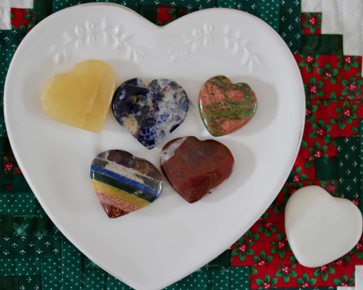 polished rock hearts on a white heart plate