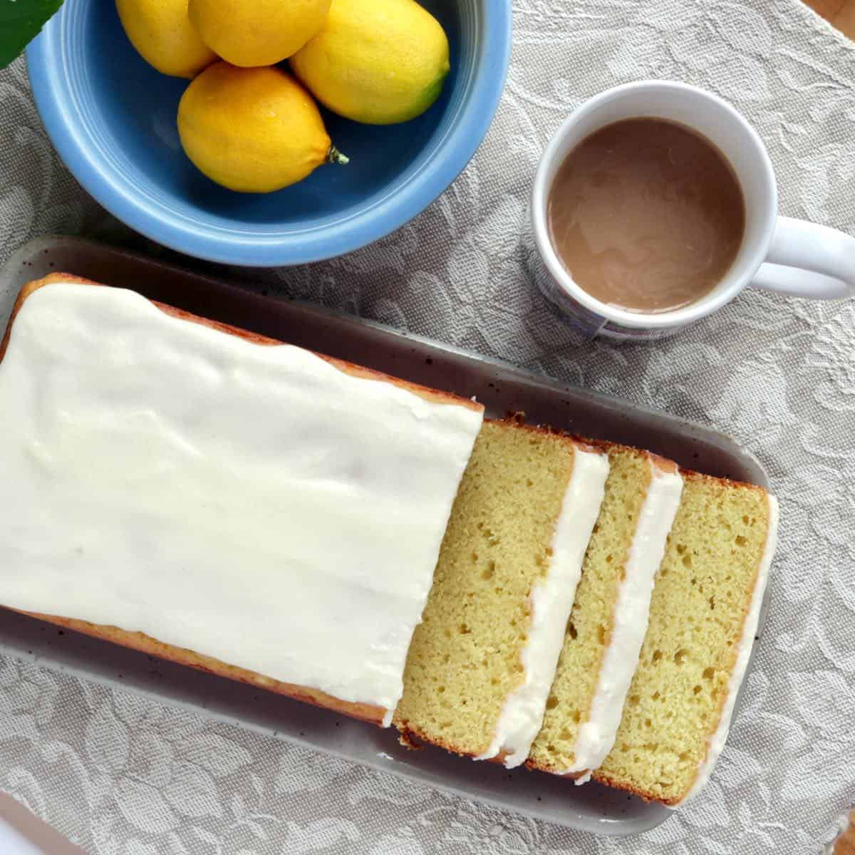 sliced lemon cake with cup of coffee