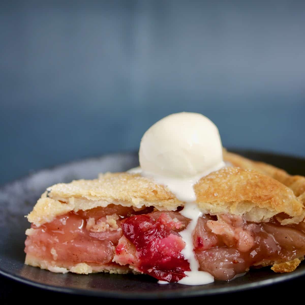 slice of sous vide apple pie with melted ice cream